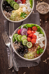 Wall Mural - Delicious Greek salad with buckwheat groats as fit food.