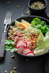 Wall Mural - Fresh Nicoise salad with groats, eggs and tuna.