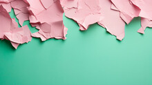 Green Paper Torn Apart On A Pink Paper Background
