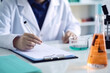 © pkproject - Researcher Documenting Scientific Observations in LAB Room