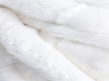 Wonderful Fluffy Natural Animal Fur Texture Background. White Arctic Polar Fox Or Rabbit Genuiene Fur. Close-up On The Detail. 