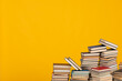science education stack of books on a yellow background teaching literacy