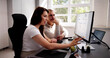 © Andrey Popov - Business People Calculating Tax Together At Desk