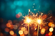 © Adrian Grosu - Sparklers over a dark background and bokeh lights, festive atmosphere