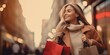 © RMedia - Cheerful woman with shopping bags at the city. Spring autumng Style. Consumerism, purchases, shopping, lifestyle, sale concept.