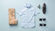 Top view Men's casual outfits with man clothing and accessories on, light blue background. 