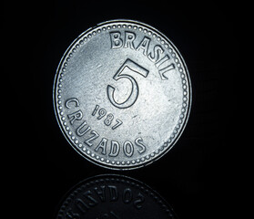 Wall Mural - Brazilian cruzados coin on a black background