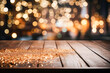 Empty wooden tabletop on background of Christmas lights, sparkling garlands, bokeh, copy space. Postcard, flyer