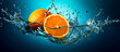A whole orange and a half are in the middle of a splash of water. The background is a deep blue, and the water looks very fresh and cool