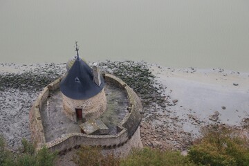 Drone shot of the Gabriel Tower in the Mont-Saint-Michel commune in France