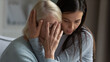 © fizkes - Caring daughter embracing, comforting soothing unhappy crying mature mother close up, helping to overcome problems, loving granddaughter cuddling supporting stressed older grandmother