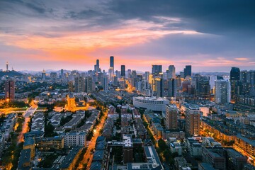 Aerial view of the stunning city skyline illuminated by the setting sun in Dalian, China