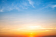© ISENGARD - Real amazing Beautiful sunrise and luxury soft gradient orange gold clouds with sunlight on the blue sky perfect for the background, take in everning, Twilight sunset sky with gentle colorful clouds