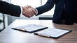 © Planetz - business people shaking hands in office