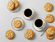 Sweet Biscuits With Glass Of Coffee On White Background