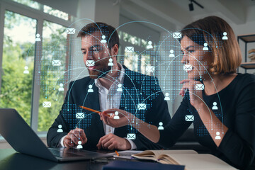 Wall Mural - thoughtful businesspeople typing on laptop at office workplace. concept of team work, business educa