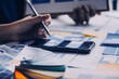 © ARMMY PICCA - Close up ux developer and ui designer brainstorming about mobile app interface wireframe design on table with customer breif and color code at modern office.Creative digital development agency