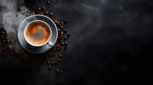 
A Cup Of Hot Coffee And Roasted Coffee Beans With A Dark Background For Copyspace - Top View