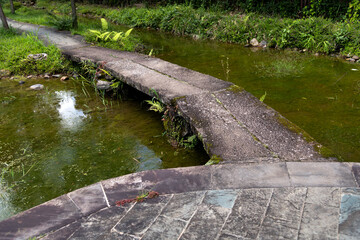 Wall Mural - Stone bridge on a small stream