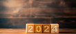 A stack of wooden blocks cube. 2024 new year concept, Copy space, Business 2024 concept, For art texture, presentation design or web design and web background.