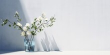 3D Transparent Blue Glass Vase With White Rose Flower, Bouquet Of Green Tree Twig In Outdoor Sunlight On Concrete Counter And Wall For Luxury Interior, Generative AI