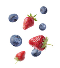 Fresh ripe blueberries and strawberries falling on white background