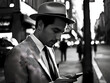 Man using phone on street, vintage image