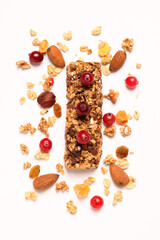 Wall Mural - Tasty granola bar and ingredients isolated on white, top view