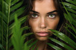 © Iryna - Beautiful young model with flawless skin and tropical leaves.