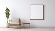 © Cloud - An empty picture frame hanging on a wall in a minimalist living room with a modern, soft glow.