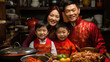 © hakule - father and daughter wearing red traditional clothing at home in Chinese lunar New Year kitchen