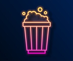 Poster - Glowing neon line Popcorn in cardboard box icon isolated on black background. Popcorn bucket box. Vector