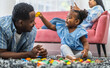 Portrait of enjoy happy love black family, play, having fun, daughter, parenthood, care, african american father and mother with little african girl child smiling moments good time at home