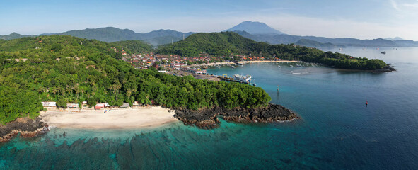 Wall Mural - Panoramic aerial view of Bias Tugel Beach, Padangbai bay and Mount Agung on sunny day. Manggis, Bali, Indonesia.