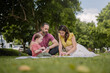 © sarayutsridee - Smiling Father, Mother and Son having fun time at home. Caucasian family with little kids son playing together in house backyard outdoors. Happy family time.