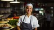 © Fred - Smiling female chef in her restaurant women owned business concept