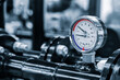 © Aleksandr Matveev - Industrial  concept. equipment of the boiler-house, - valves, tubes, pressure gauges, thermometer. Close up of manometer, pipe, flow meter, water pumps and valves of heating system in a boiler room.