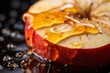 Fresh red apples with drops of honey on a black background close up
