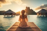 Fototapeta  - Lovely graceful lady sit in a luxury resort at sunset with beautiful seascape. Summer tropical vacation concept.