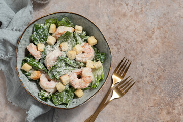 Wall Mural - Fresh caesar salad on bowl with parmesan cheese and shrimps