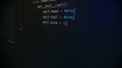Typing programming language code on a computer screen. Computer specialist is writing the programming language code. Creating a data analysis system using programming language code. Script. Matrix
