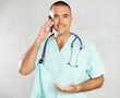 Engaged in direct telephonic conversation, male physician imparts medical insights remotely.