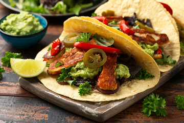 Poster - Fried halloumi fajitas with pan roasted onions and bell peppers, avocado guacamole and pickled jalapeno peppers