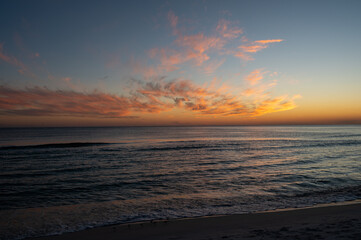 Wall Mural - Colorful evening cloudscape after sunset over Gulf of Mexico off Panama City Beach, Florida.