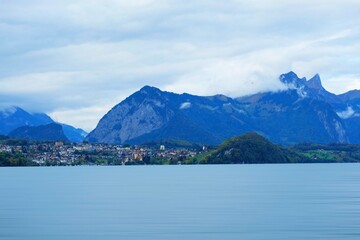 Wall Mural - I traveled by a boat trip from Interlaken pier to Thun City, and captured the landscape of surroundings at the lake of Thun City, Switzerland, on 15 October, 2023.