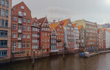 Fototapeta  - The Nikolaifleet, a canal in the old town (Altstadt) of Hamburg, Germany. It is considered one of the oldest parts of the Port of Hamburg.