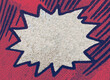 Closeup of real vintage comic book page with empty white speech bubble on a background texture of colorful red blue printing dots