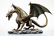 A Bronze Dragon Figurine On A White Background
