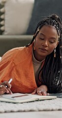 Poster - Budget, finance and black woman writing on a floor with calculator, book or research at home. Financial management, notebook and African student in a living room for e learning math upskill course