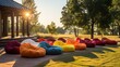  Bagger bean bags rest on the shady grass, offering a relaxed seating option in a modern outdoor party setting.
